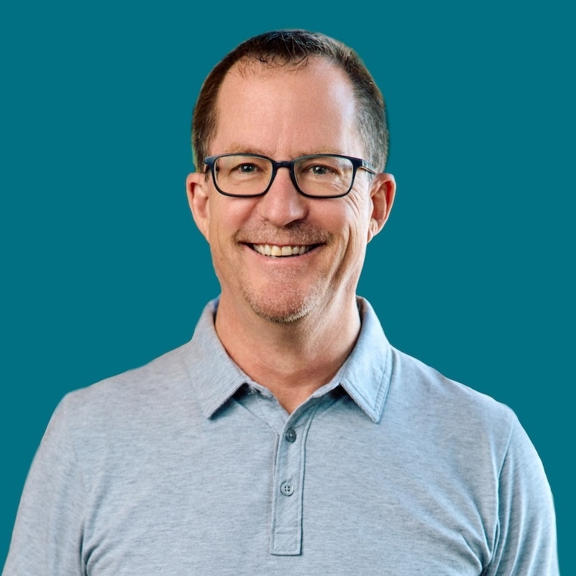 Greg Head headshot photo - blue